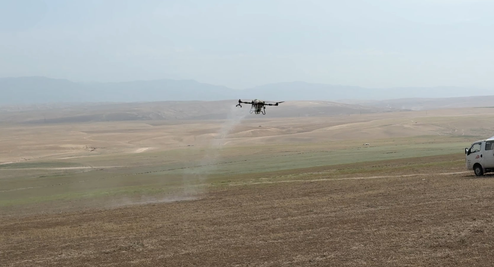 FP700 agri drone is spraying insecticide for pest control